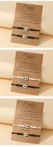 Detail of woven soccer friendship bracelets on sentiment card packaging for gifts