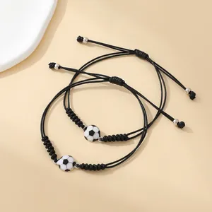Adjustable black woven soccer friendship bracelets with football beads and metal details