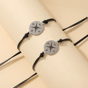 Verstelbare zwarte gevlochten koppelarmbanden met roestvrijstalen kompas-hangers