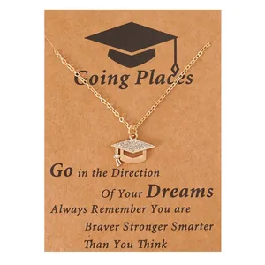 Gold graduation cap pendant necklace with sparkling rhinestones on gift card packaging