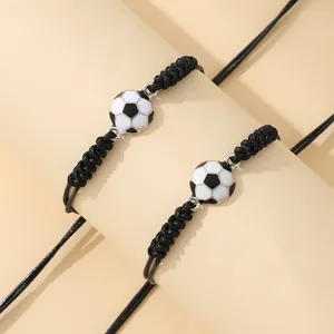 Two-piece set of woven football charm bracelets with adjustable black PU leather cords