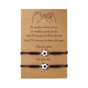 Braided soccer friendship bracelets set with charm on kraft card display