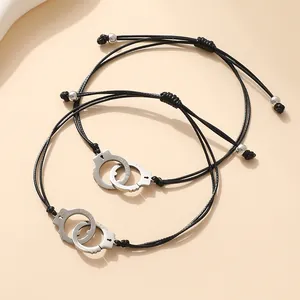 Pair of adjustable black wax rope handcuff bracelets for couples with metal pendants