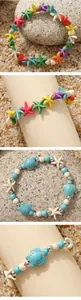 Detail van boho-armbanden met kleurrijke zeesterren en turquoise schildpad-bedels in set