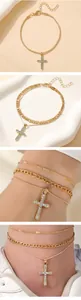 Detail of multi-layer gold chain bracelet set with a sparkling rhinestone cross pendant