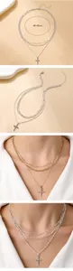 Macro detail of triple-layer chain necklace featuring crystal cross pendant design