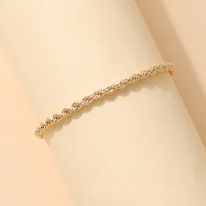 Elegant gold rope chain bracelet for women featuring a minimalist twisted metal design