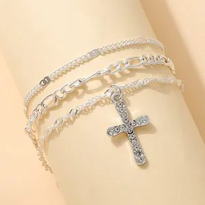 Three-layer silver cross pendant bracelet with curb chain and sparkling cubic zirconia