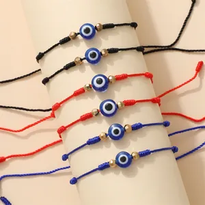 Verstelbare Evil Eye gevlochten armbanden in rood, zwart en blauw met gouden kralen