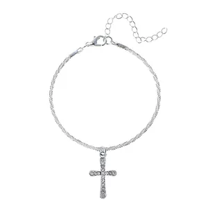 Silver-colored layered bracelet with sparkling rhinestone-encrusted cross charm