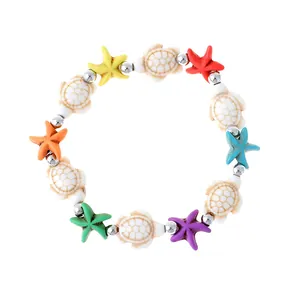 Bohemian oceaan armband met kleurrijke zeesterren en turkoois schildpad kralen