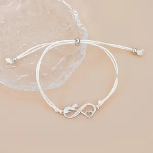 Minimalist white braided infinity cat charm bracelet with adjustable silver sliding closure