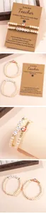 Detailed set of wooden bead teacher bracelets with apple charm and TEACH letter beads