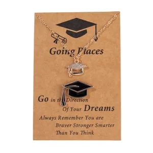 Golden graduation cap pendant necklace set with crystal rhinestones on a gift card