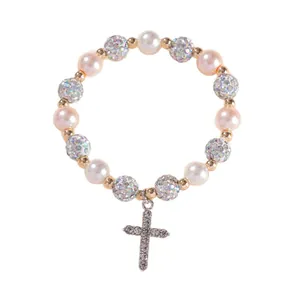Elegant beaded bracelet with pink pearls, glitter balls and a sparkling cross pendant