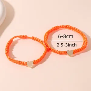 Verstellbare orange gewebte Herzarmbänder mit goldenen Anhängern für Damen und Freunde