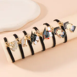 6-piece woven graduation bracelet set with gold beads and enamel academic charms