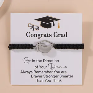 Braided graduation bracelet with silver mortarboard charm on congratulatory display card