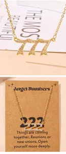 Close-up of sparkling rhinestone angel number necklaces 777 and 222 with gift card