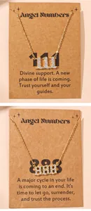 Close-up of angel number pendants 111 and 888 with crystals on gift cards