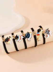 Detailed set of handmade woven graduation bracelets with colorful enamel charms