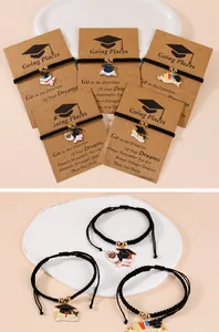 Adjustable woven graduation bracelet with enamel mortarboard charm and inspirational card