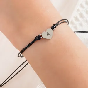 Handmade woven heart bracelet with engraved initial A in minimalist stainless steel