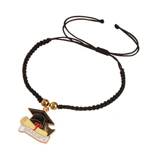 Adjustable black braided graduation bracelet with mortarboard and heart scroll charms