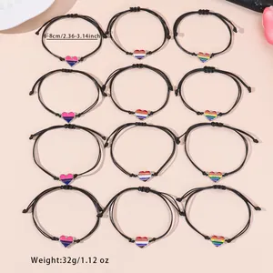 Set of 12 handmade braided heart bracelets with colorful enamel charms for women