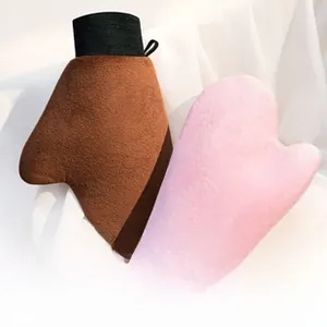 Close-up of soft velvet body lotion mitts with convenient hanging loops for skin care