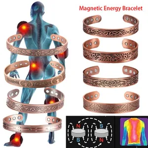 Macro detail of copper magnetic energy bracelets with vintage relief patterns and magnets