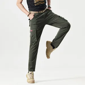 Detail of military green cargo pants featuring large side pockets and a durable fabric