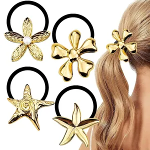 Detail of gold floral and starfish hair ties with high elasticity black rubber bands