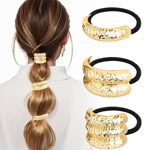 Detail of gold textured metal hair ties with lava ripples on high elastic rubber bands