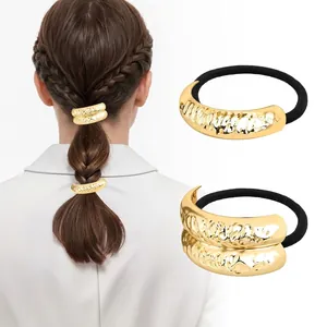 Detail of hammer-textured gold metal charm on high-elasticity black hair tie band