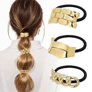 Detailed view of elastic hair ties featuring geometric gold accents and high gloss finish