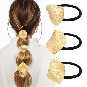 Detail of high-elasticity hair ties with polished geometric gold metal decorations