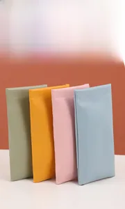 Close-up of portable PU leather sunglasses pouches in four colors with stitching detail