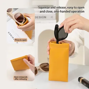 Bright yellow PU leather sunglasses pouch with squeeze closure and portable design