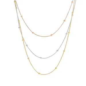 Collier à trois couches en acier titane avec perles en or rose, argent et or