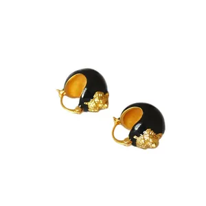 Retro gold relief tiger head earrings with black enamel and chic lion design