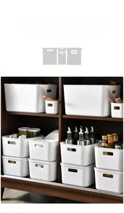 Detail of white plastic storage bins with handles inside a kitchen cabinet setup