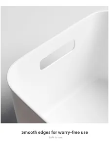 Close-up of white storage bin with smooth edges and an oval handle for safe handling
