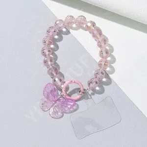 Detail of pink beaded phone charm strap with large purple butterfly pendant and clear clip