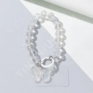 Detail view of crystal beaded phone chain with iridescent butterfly pendant and white clasp