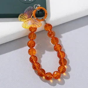 Handgefertigte orangefarbene Handyperlenkette mit schillerndem Schmetterling