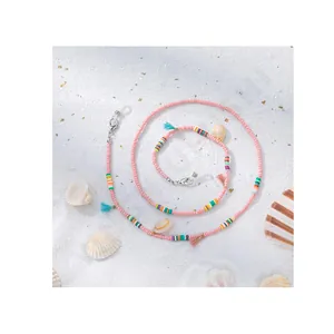 Chaîne à lunettes bohème en perles de verre avec pompons colorés et pendentifs coquillages