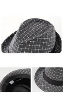 Detail of grey plaid fedora showing 100% polyester fabric texture and inner labels