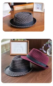 Close-up of retro plaid pattern texture on cotton fedora hats in brown and burgundy