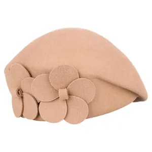 Detail of camel wool beret with three-dimensional felt flower ornaments and rich texture
